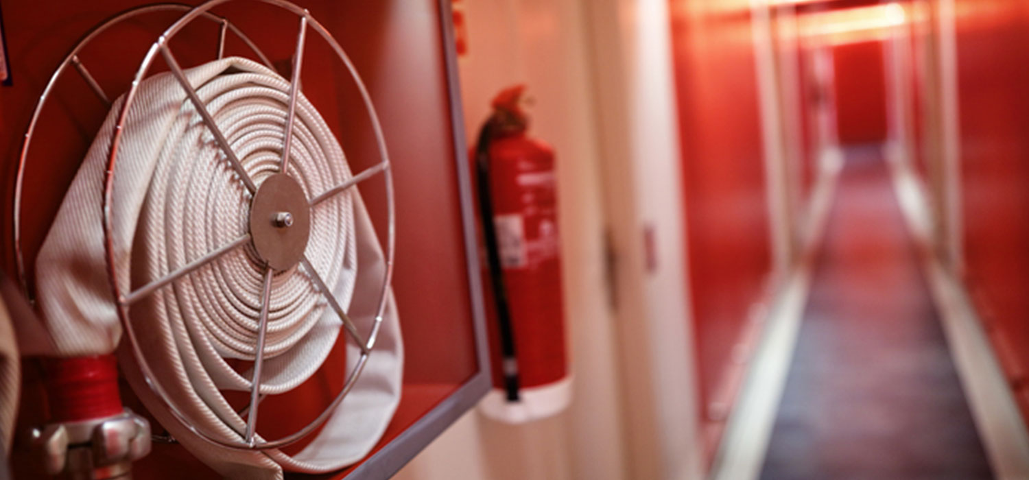 fire hose reel and fire extinguisher in hallway, Fire Watch Company Jupiter, Fire Watch Companies, Fire Watch Security, Fire Watch Services, Jupiter FL, West Palm Beach, Wellington, Lake Worth, Lake Park, Boca Raton, Palm Beach Gardens, Royal Palm Beach, Boynton Beach, Lantana, Duval County, St. Johns County, Flagler County, Volusia County, Jacksonville, New Smyrna